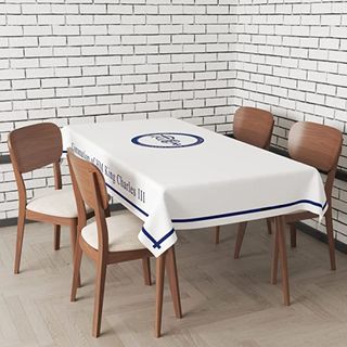 Table with four chairs covered in coronation table cloth
