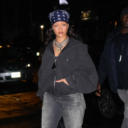 Rihanna in a head scarf and multiple necklaces