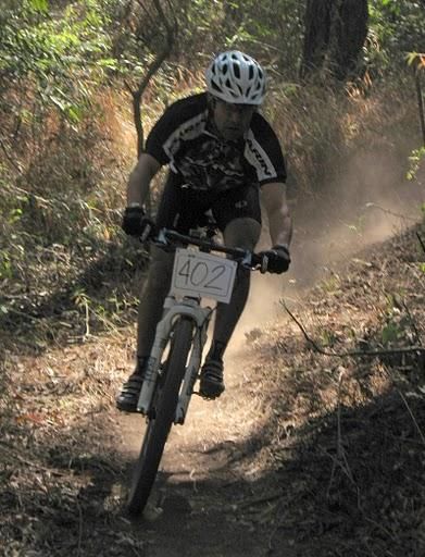 A racer blazes around the cross country course.
