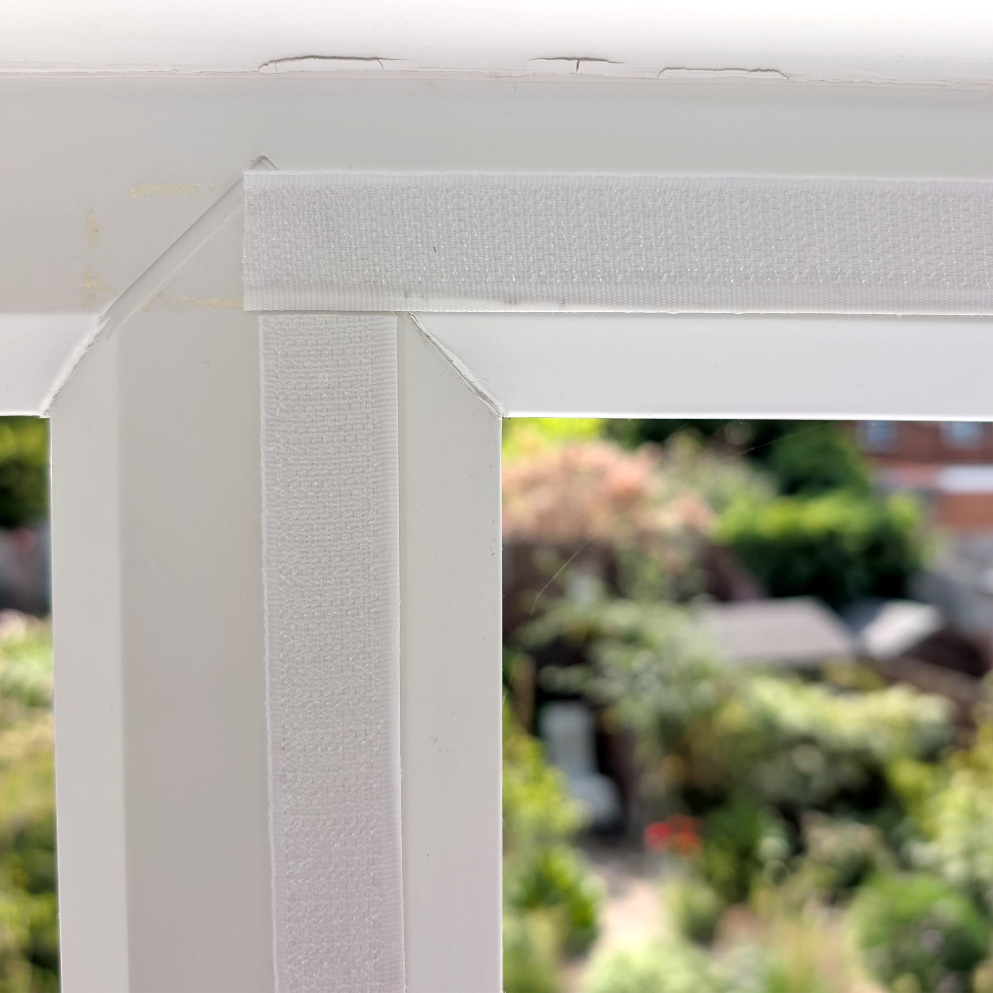 A DIY mosquito screen made with Velcro tape and fly mesh cut to size