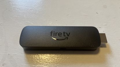 Amazon Fire TV Stick 4K (2023) on wood table