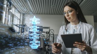 An engineer examines an AI hologram