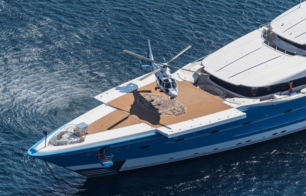 A helicopter landing on a luxury superyacht 