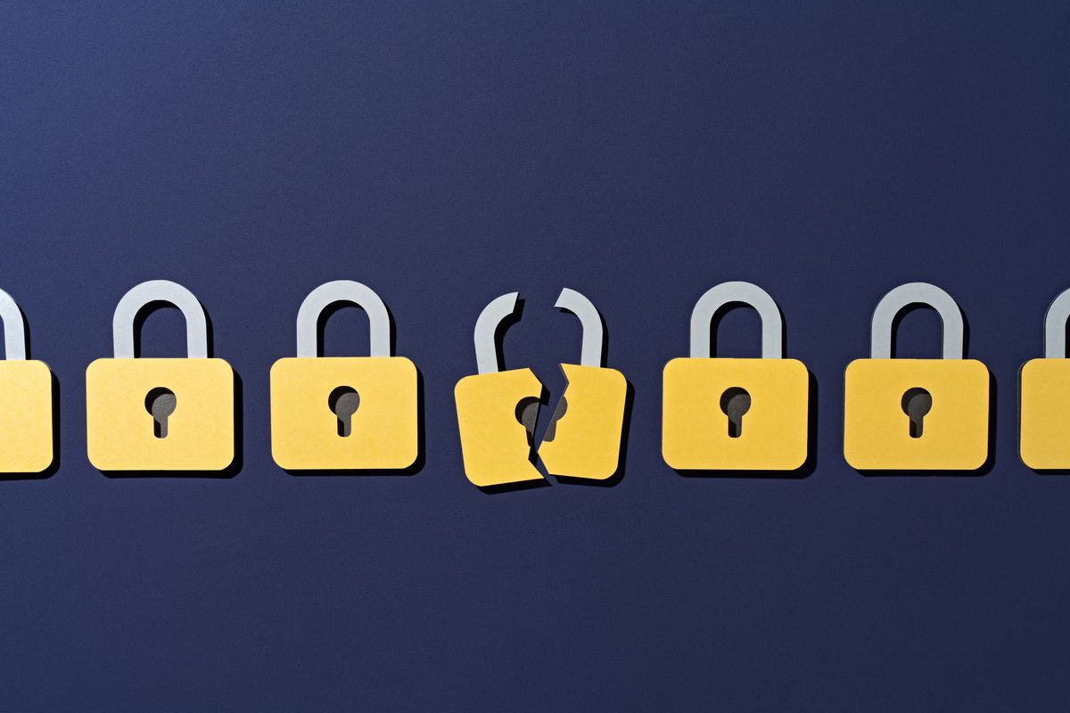 Online Safety Bill&#039;s encryption policies denoted by a series of gold padlocks lined up side-by-side, with the center padlock cracked down the middle, showing a break