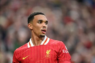 Trent Alexander-Arnold Liverpool right-back puts his shirt to his mouth during a Premier League game at Anfield as Real Madrid speculation continues