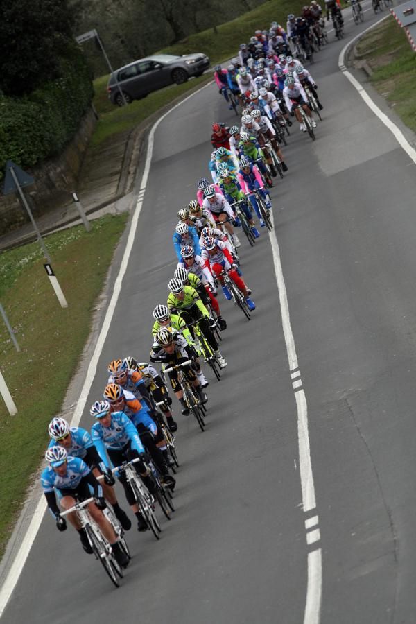 The peloton lines-out behind Milram