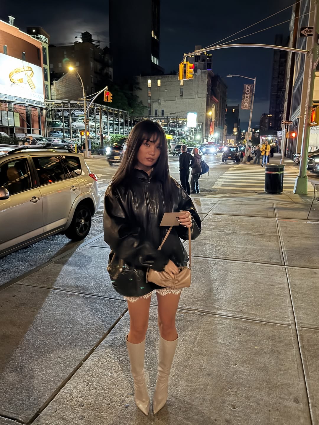 woman wearing knee high fitted boots