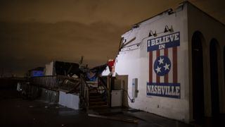 A mural reading "I believe in Nashville" remains intact on a collapsed wall in the East Nashville neighborhood on March 3, 2020 in Nashville, Tennessee. 