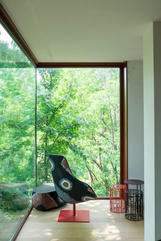 how to bring the outdoors in with glass walls