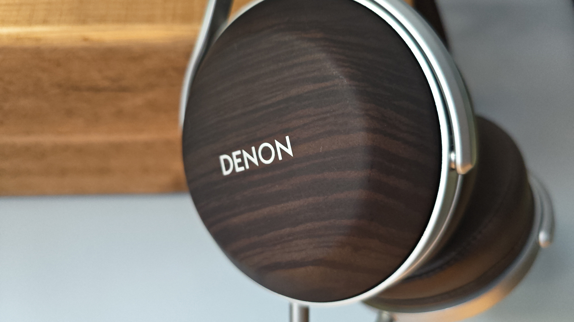 The Denon AH-D5200 and other headphones, photographed on a home desktop. 