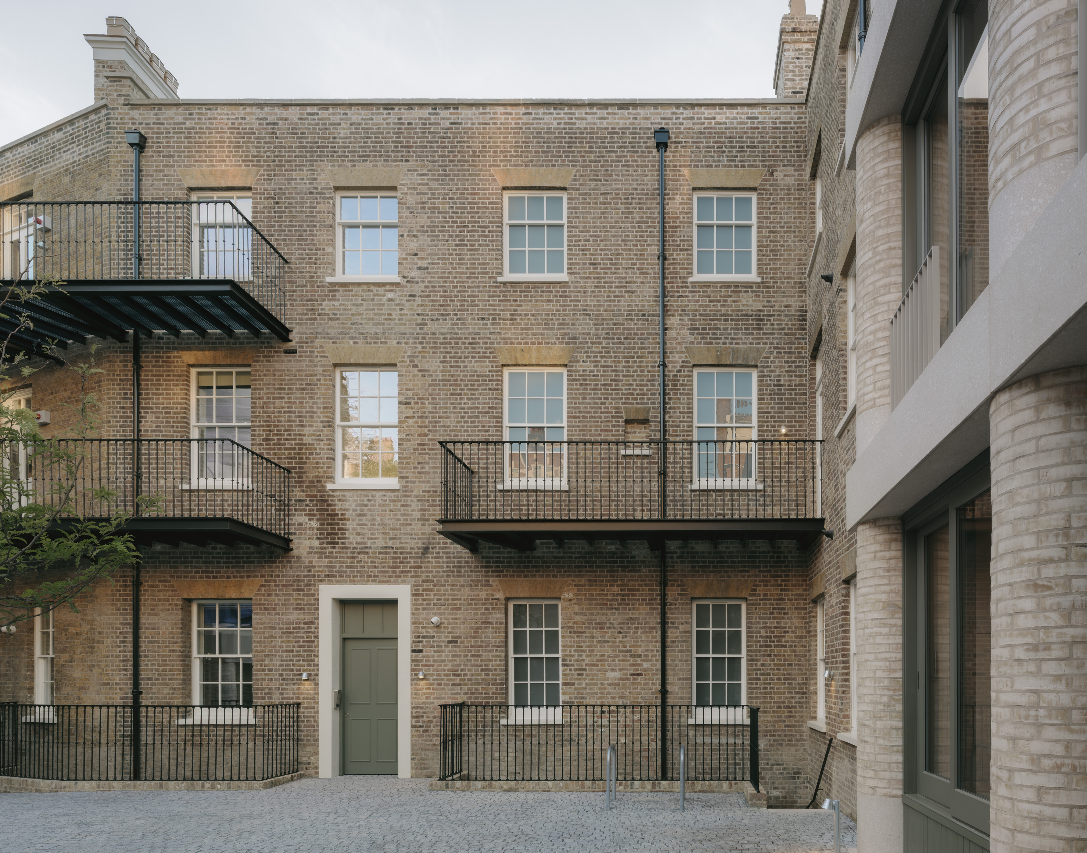 20 Newcourt Street, by Wendover, a london development of old and new with round columns and brick frontage