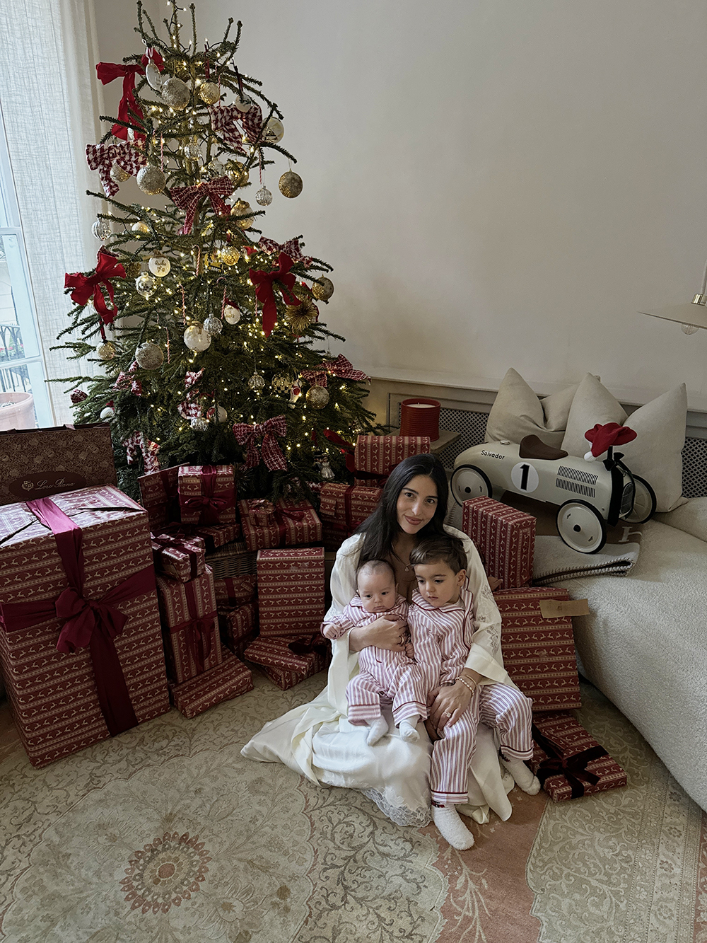 Bettina Looney and sons next to Christmas tree