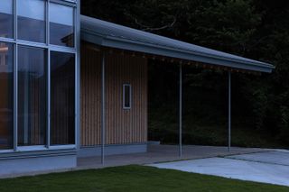 exterior detail of house in hasami featuring glass, metal and timber