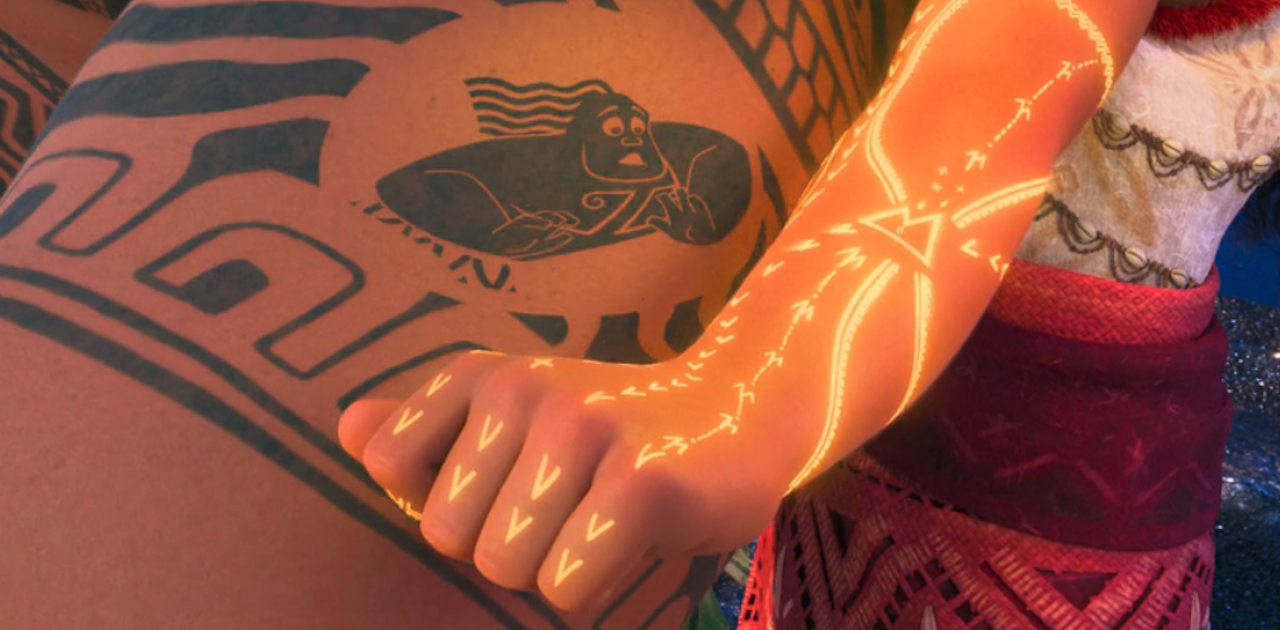 Moana showing off her new tattoo next to mini Maui in Moana 2