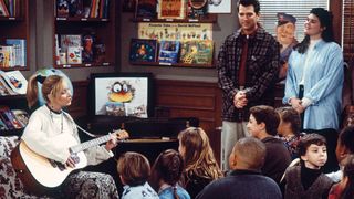 Phoebe Buffay (Lisa Kudrow) performs a song to a group of children