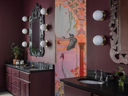 A bathroom with burgundy walls and pink wallpaper
