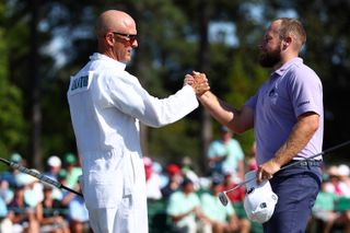 Tyrrell Hatton shakes hands with his caddie