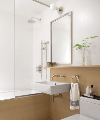 White bathroom with large mirror