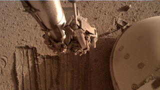 robotic arm on mars above digging marks