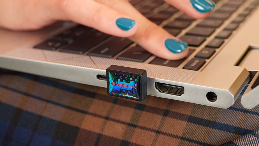 The SanDisk Extreme Fit USB-C flash drive plugged into a laptop USB port