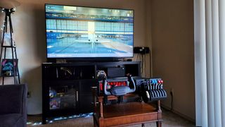 Honeycomb Aeronautics Alpha Flight Controls XPC and Bravo Throttle Quadrant in front of TV and Xbox Series X.