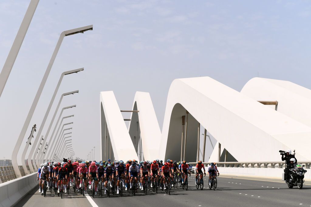 ABU DHABI UNITED ARAB EMIRATES FEBRUARY 21 A general view of the peloton passing across a bridge landscape during the 4th UAE Tour 2022 Stage 2 a 176km stage from Hudayriyat Island to Abu Dhabi Breakwater UAETour WorldTour on February 21 2022 in Abu Dhabi United Arab Emirates Photo by Tim de WaeleGetty Images