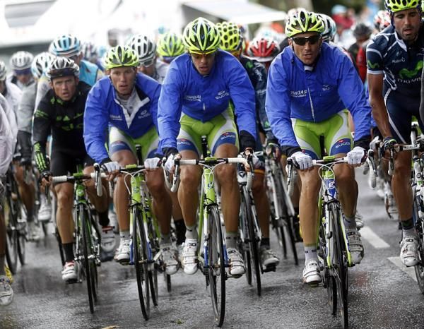 The peloton donned rain capes to fend off the wet weather.