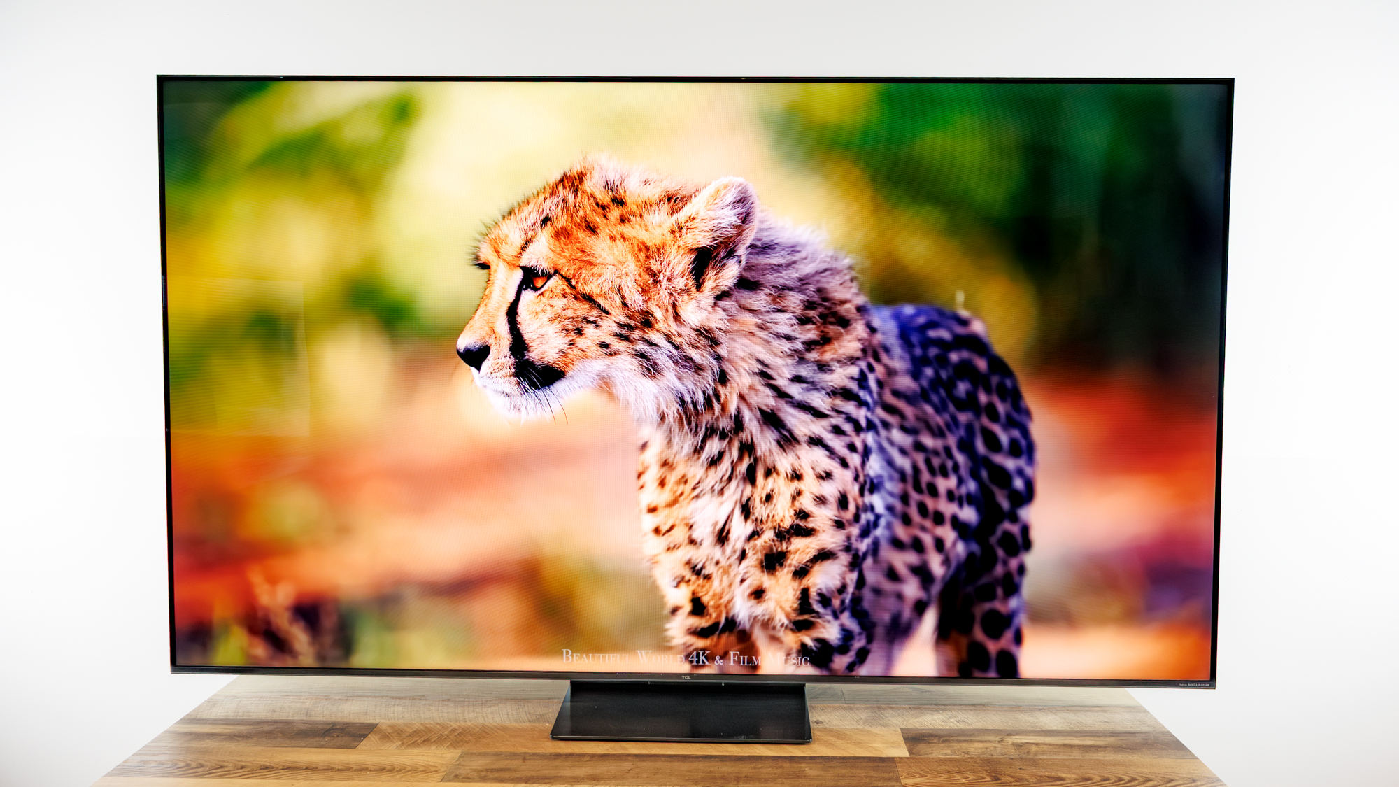 TCL QM7L 75-inch TV on a desk