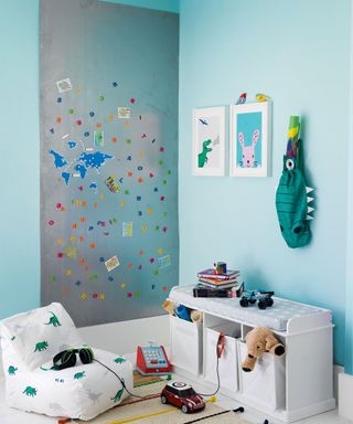 blue boys bedroom with wall stickers and low storage bench