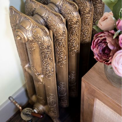 Green bedroom with brass radiator