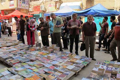 People in Baghdad buy books to donate to Mosul.