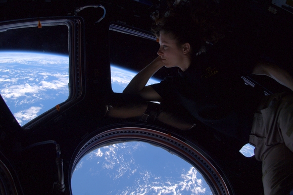 Douglas H. Wheelock, &quot;Astro_Wheels&quot; on Twitter, shared this picture of Astronaut Tracy Caldwell Dyson looking down on Earth from the cupola of the International Space Station.