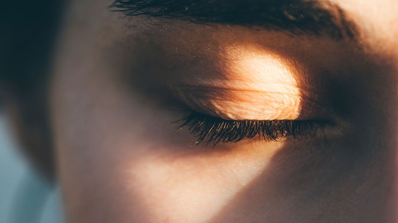 A woman&#039;s eyelashes in the sunlight