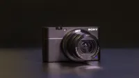 The Sony RX100 V on a table with a black background