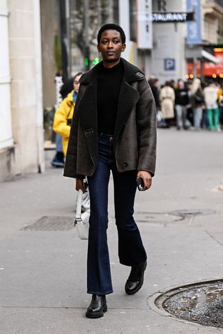 Woman wearing a winter jacket outfit.