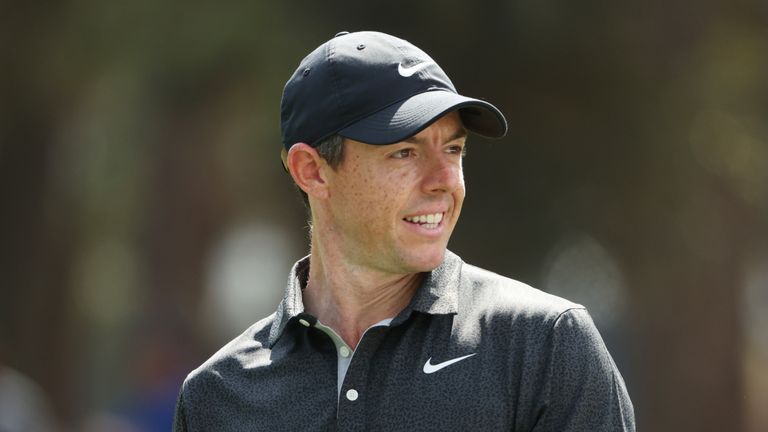 Rory McIlroy stares after hitting golf shot