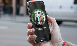 A person holding an iPhone X