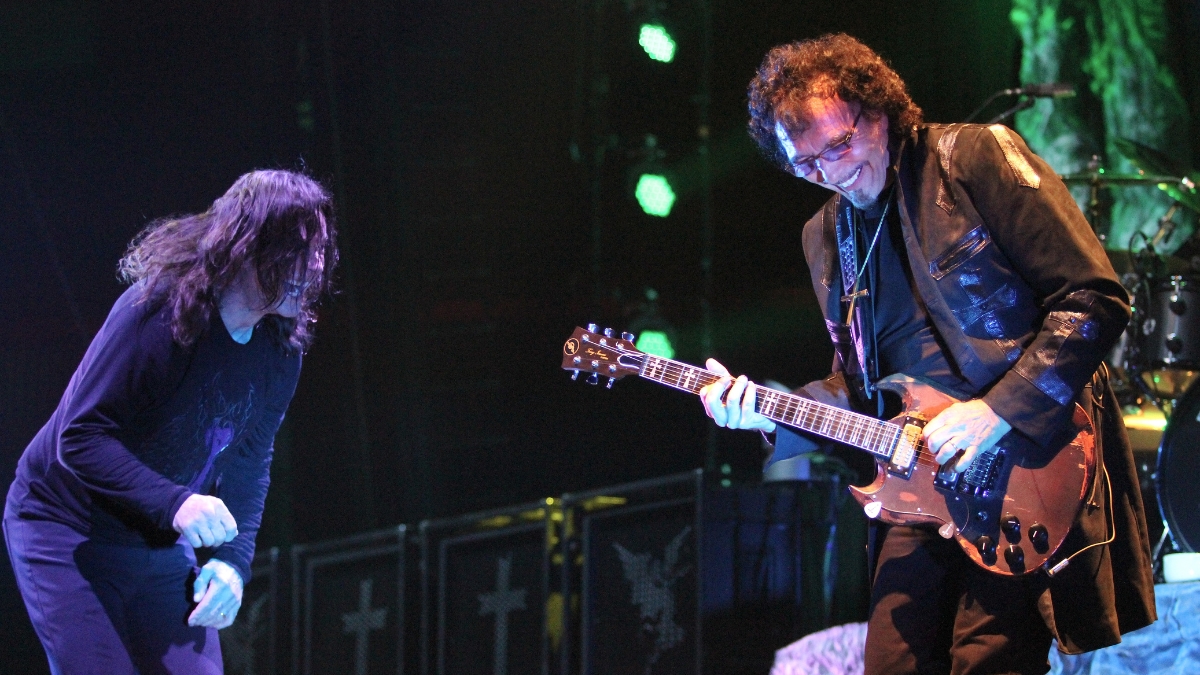 Singer Ozzy Osbourne and guitarist Tony Iommi are shown performing on stage during a live concert appearance on August 8, 2013
