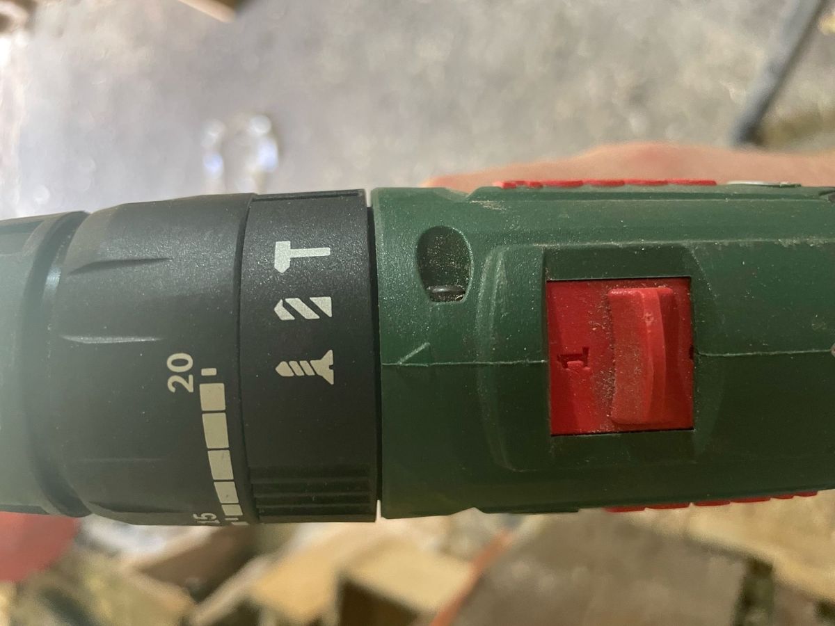A Bosch 18v drill has two speeds on top, torque settings and a screwdriver, drill and hammer drill setting on top
