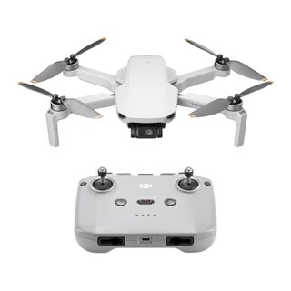 DJI Mini 4K and controller on white background