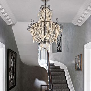 room with staircase and ceiling light