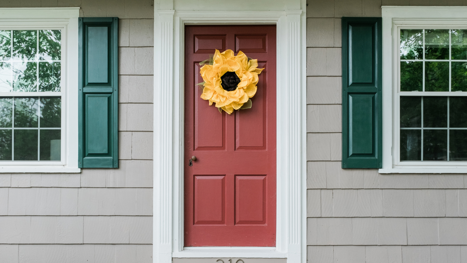 What does blowing cinnamon on your front door do?