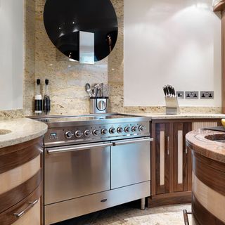 kitchen with range cooker and wooden cabinet