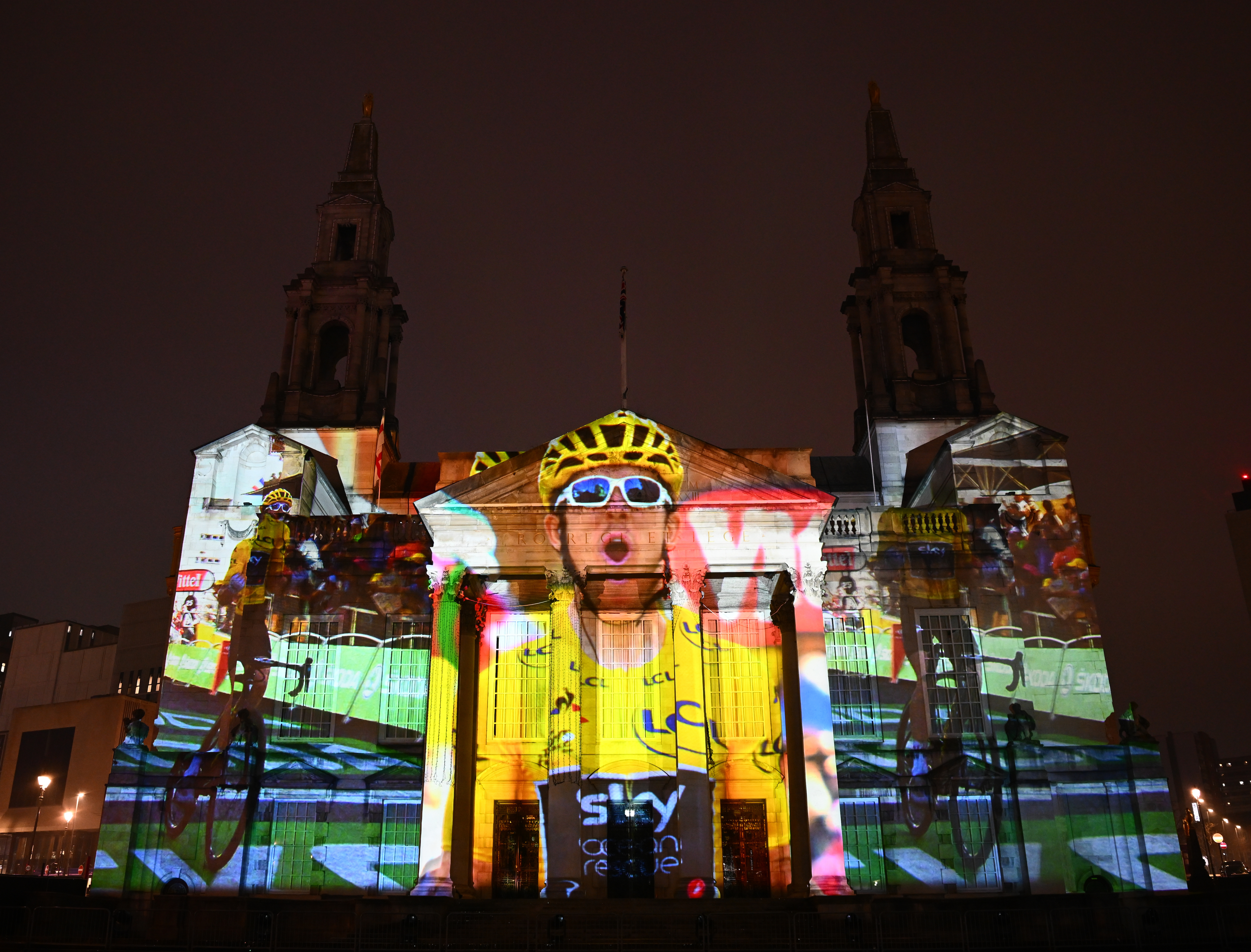 A projection of Geraint Thomas in the yellow jersey on Leeds City Hall