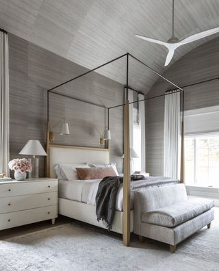 grey vintage area rug in luxury bedroom by Marie Flanigan