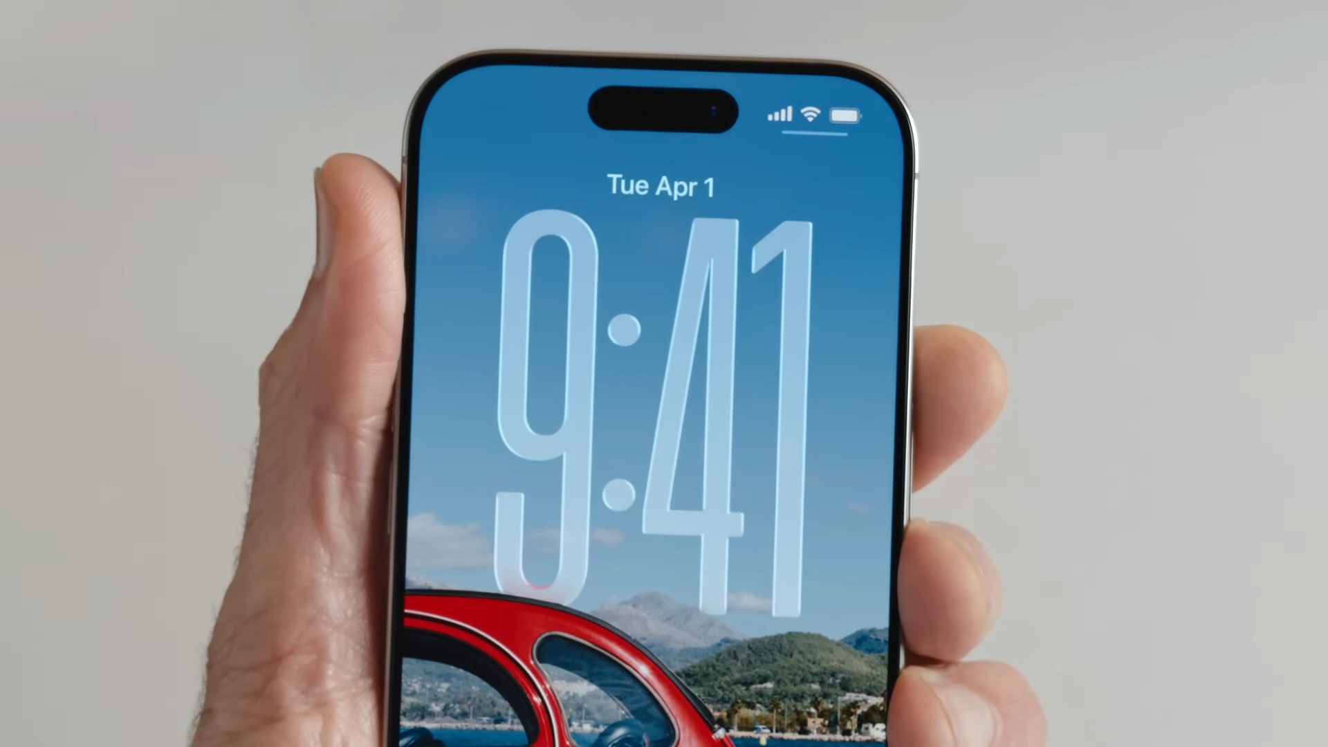 The Liquid Glass clock on the iOS 26 Lock Screen being demonstrated at Apple&#039;s Worldwide Developers Conference (WWDC) in June 2025.