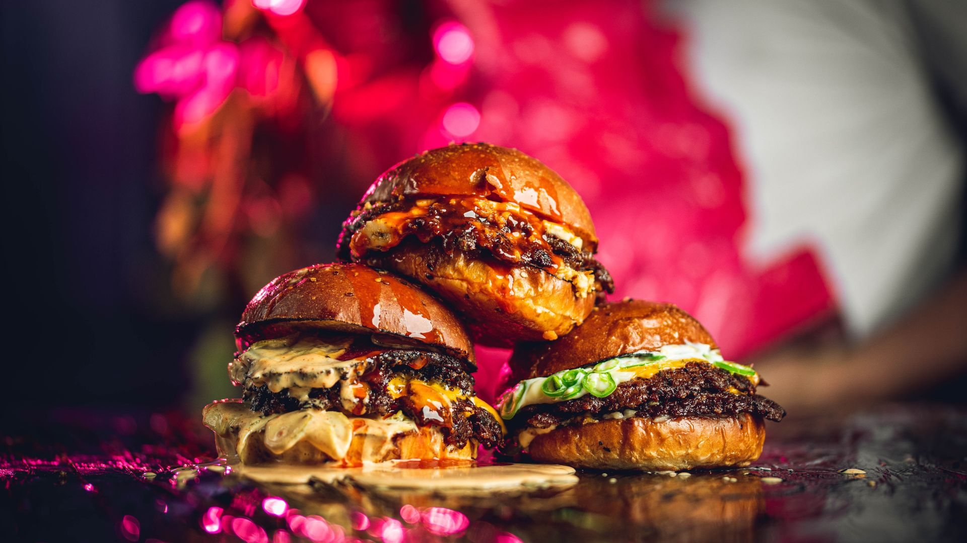 an image of three burgers stacked on top of one another