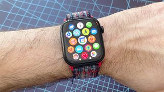 Close up of an Apple Watch Series 10 showing the steps to install the Google Calendar app, including navigating to the app store, searching and downloading the app and syncing it with your iPhone