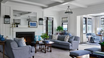 living room white walls and blue sofas and accents