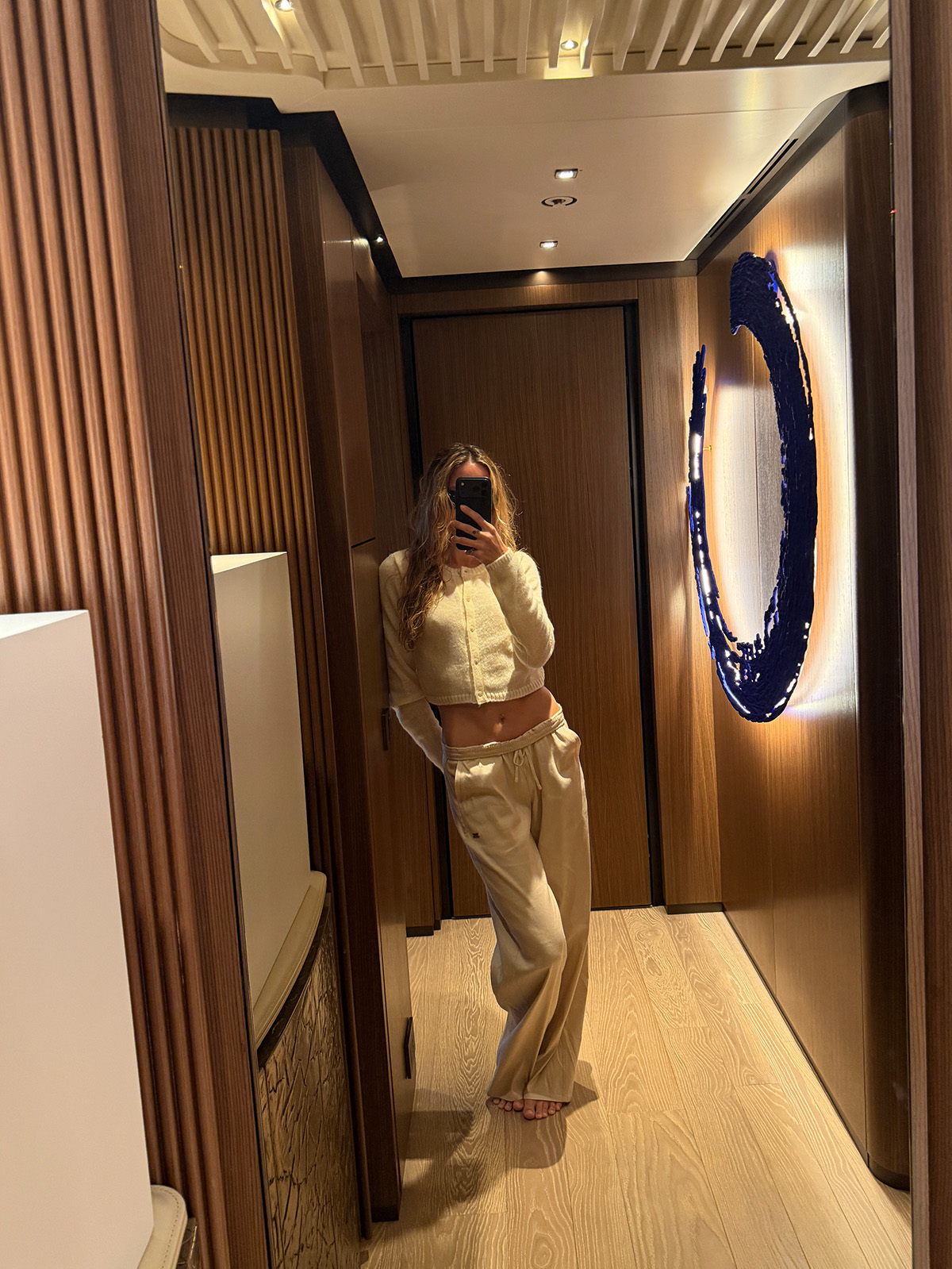 Eliza Huber wearing an Alo Atelier cashmere cardigan and linen pants.